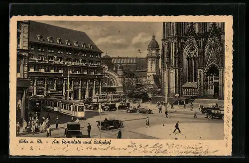 AK Köln a. Rh., Strassenbahnen am Dompltz und Bahnhof