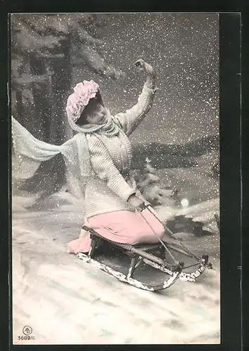 AK Fräulein auf einem Schlitten im Schnee