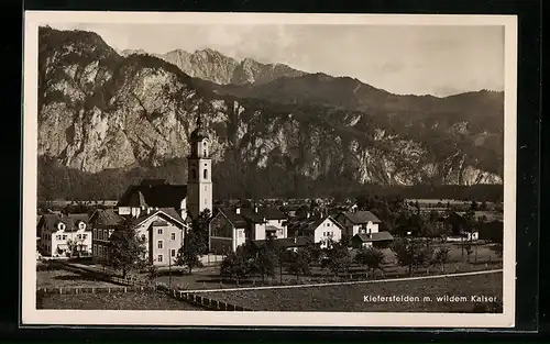 AK Kiefersfelden, Ortsansicht mit Kirche und wildem Kaiser