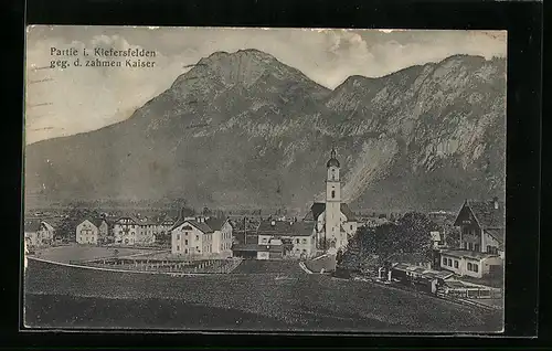 AK Kiefersfelden, Ortsansicht mit Kirche gegen den zahmen Kaiser