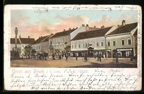 AK Bruck /Leitha, Hauptplatz mit Passanten und Geschäften