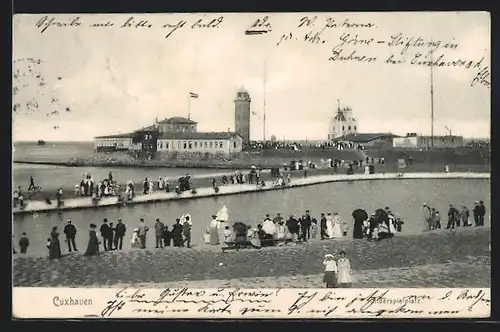 AK Cuxhaven, Kinderspielplatz und der Leuchtturm im Hintergrund