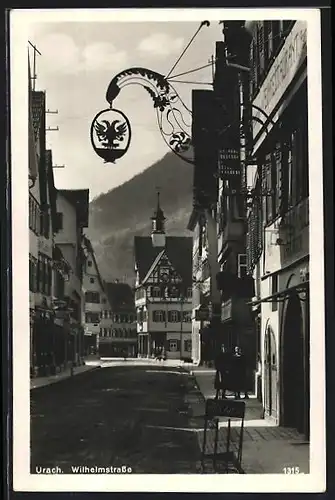 AK Urach, Wilhelmstrasse am Gasthaus zum Adler von Karl Reich