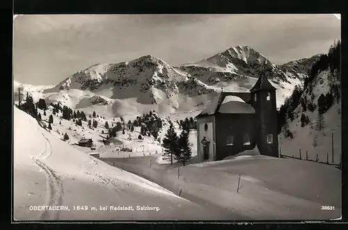 AK Obertauern bei Radstadt, Ortspartie mit Kirche im Schnee