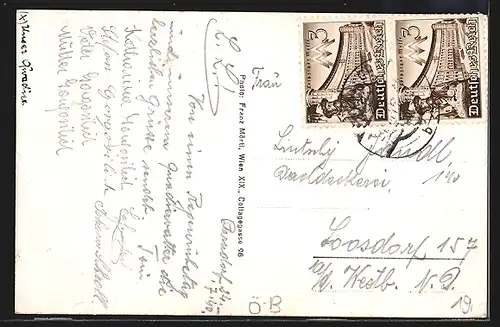 AK Parndorf, Gasthaus von Franz Illenschitz, Strassenpartie mit Kirche