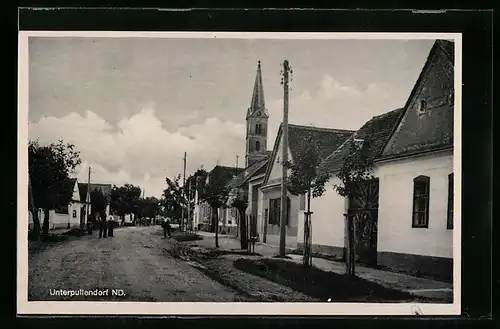 AK Unterpullendorf, Strassenpartie mit Blick zur Kirche