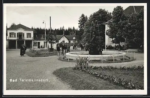 AK Bad Tatzmannsdorf, Ortspartie am Brunnen, Tabakhandlung
