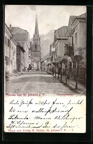 AK St. Johann i. P., Hauptstrasse mit Kirche