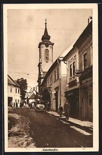 AK Szentendre, Strassenpartie mit Geschäften und Kirche