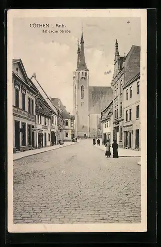 AK Cöthen i. Anh., Hallesche Strasse mit Geschäften und Kirche