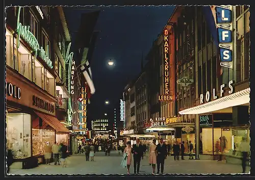 AK Kiel, Holstenstrasse mit Geschäften bei Nacht