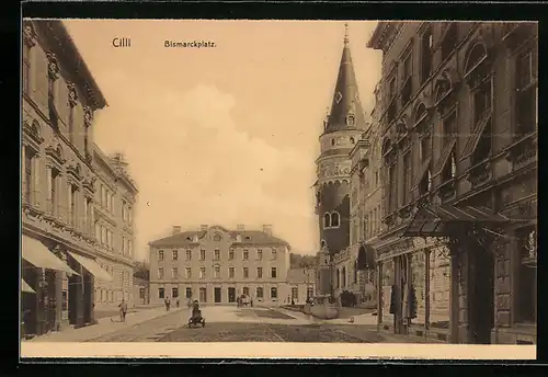 AK Cilli, Bismarckplatz mit Geschäften und Turm