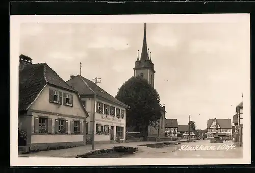 AK Kleukheim /Obfr., Ortsansicht mit Kaufhaus Helmreich und Kirche