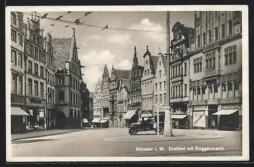 AK Münster i. W., Drubbel mit Roggenmarkt, mit Geschäften und Automobil