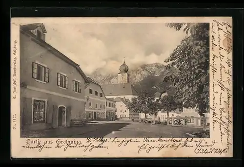 AK Gröbming, Strassenpartie mit Gasthof und Blick zur Kirche