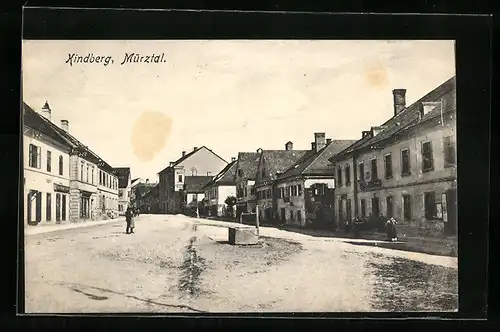 AK Kindberg /Mürztal, Strassenpartie mit Ladengeschäften und Brunnen