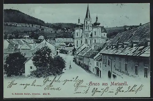 Mondschein-AK Mariazell, Strassenpartie mit Gasthaus Zur goldenen Kanone und Kirche