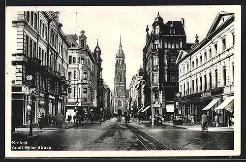 AK Krefeld, Strasse mit Geschäften und Apotheke