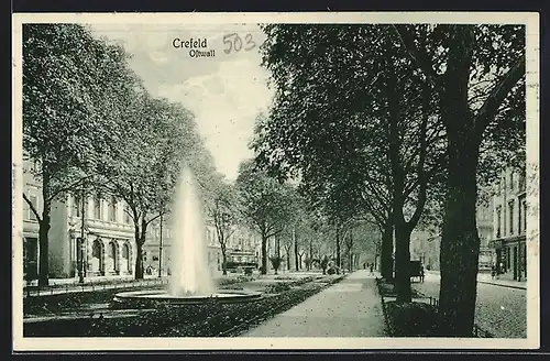 AK Krefeld, Strasse am Ostwall mit Fontäne