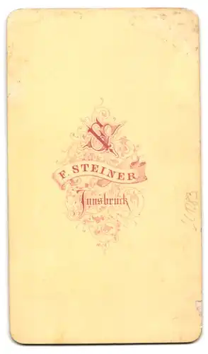 Fotografie F. Steiner, Innsbruck, Portrait Soldat im Uniformmantel