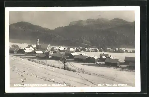 AK Bezau, Ortsansicht im Winter mit Canisfluh