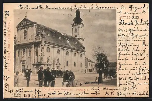 AK Bruck a. d. Leitha, Pfarrkirche vom Hauptplatz betrachtet