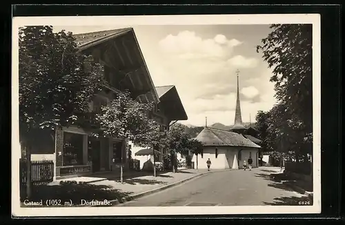 AK Gstaad, Dorfstrasse mit Blick zur Kirche