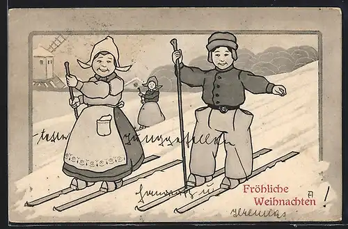 AK Holländisches Paar auf Skiern, Weihnachtsgruss