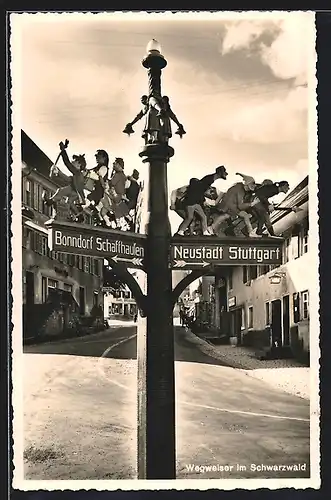 AK Wegweiser mit wandernden Figuren nach Schaffhausen und Stuttgart