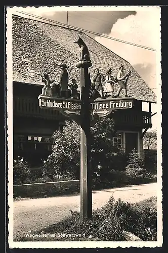 AK Bürger und Wolf auf dem Wegweiser nach St. Blasien und Freiburg