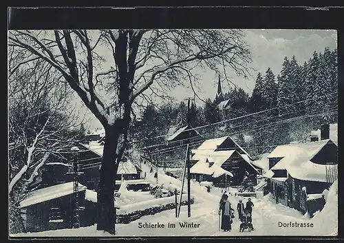 AK Schierke, Blick auf Dorfstrasse im Winter