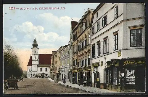 AK Aschach a. D., Kurzwernhardplatz mit Geschäften und Blick zur Kirche