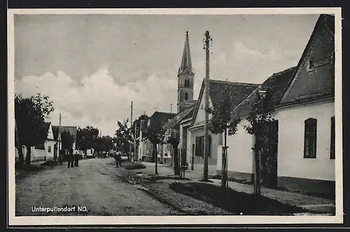 AK Unterpullendorf, belebte Strassenszene mit Kirche