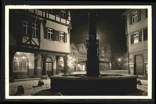 AK Bad Urach, Marktbrunnen im Winter