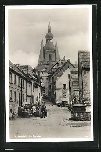 AK St. Wendel, Strassenpartie im Graben, Blick zur Kirche