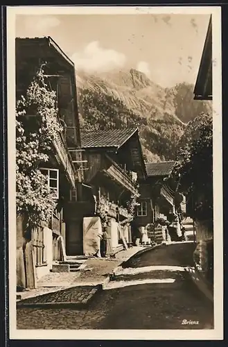 AK Brienz, Strassenansicht mit Mann