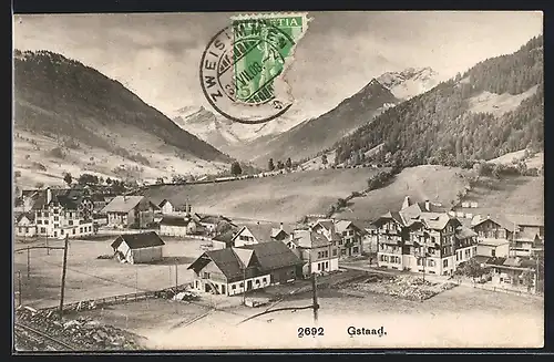 AK Gstaad, Ortspartie mit Bergen