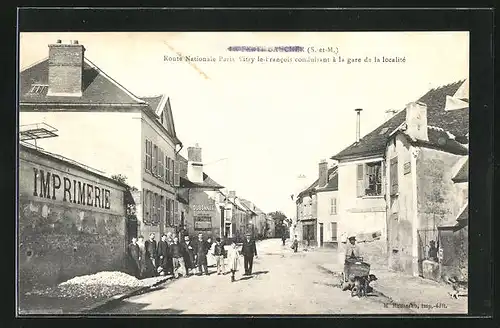 AK La Ferte-Gaucher, Route Nationale Paris á la gare de la localité