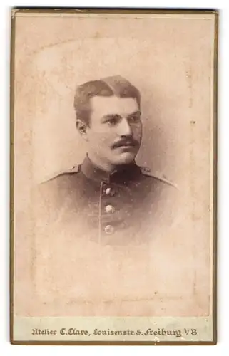 Fotografie C. Clare, Freiburg i / B., Portrait Soldat in Uniform mit Schnurrbart