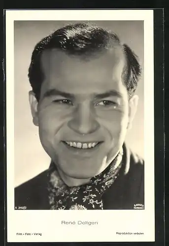 AK Schauspieler Renè Deltgen mit Halstuch zur Seite lächelnd
