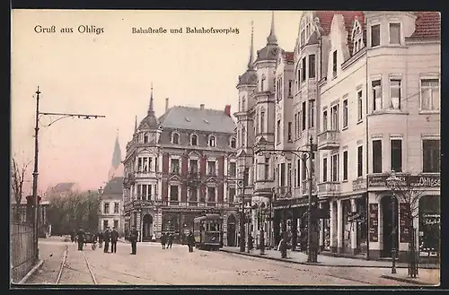 AK Ohligs, Bahnhofsvorplatz und Bahnstrasse mit Geschäften und Strassenbahn