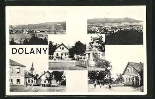 AK Dolany, Marktplatz mit Denkmal und Passanten, Gebäudeansicht von Aussen, Teilansicht vom Ort