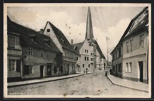 AK Sandersleben, Strassenpartie mit Kirche