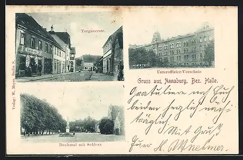 AK Annaburg /Bez. Halle, Strassenpartie mit Geschäft, Unteroffizier-Vorschule, Denkmal mit Schloss