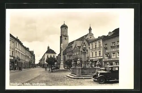 AK Weilheim / Obb, Stadtplatz mit Geschäft und Brunnen