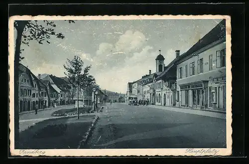 AK Kindberg, Hauptplatz mit Häuserzeilen und Blick auf den Kirchturm