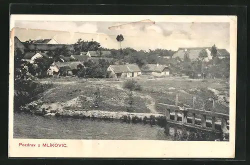 AK Neveklov - Mlekovice, Blick zum Ort vom Wasser aus