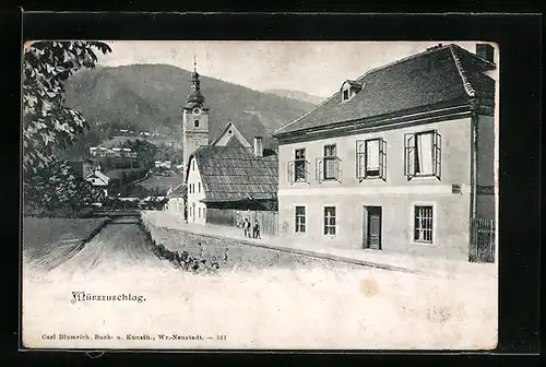AK Mürzzuschlag, Strassenpartie mit Kirchturm