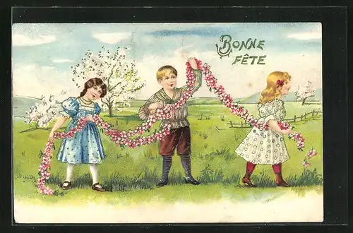 Präge-AK Kinder, drei Kinder auf einer Wiese flechten Blumen