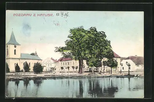 AK Katusice, Blick über den Teich zur Kirche